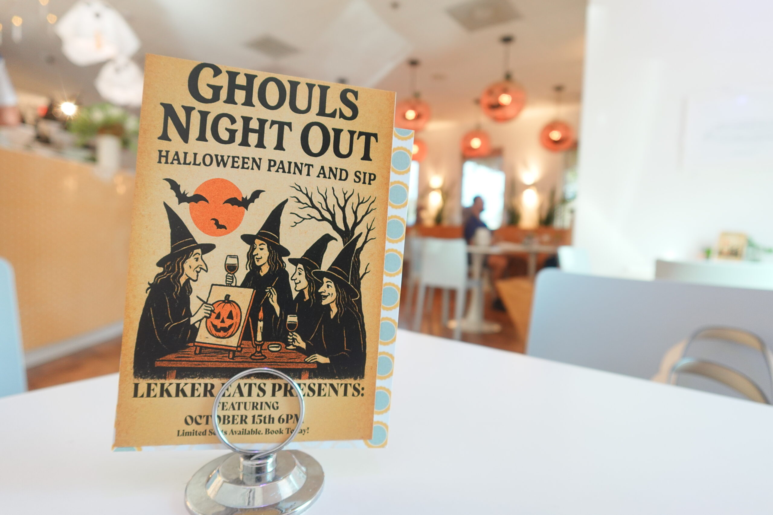 Sign for Lekker Eats Ghouls Night Out Halloween Paint and Sip event in Myrtle Beach, SC.